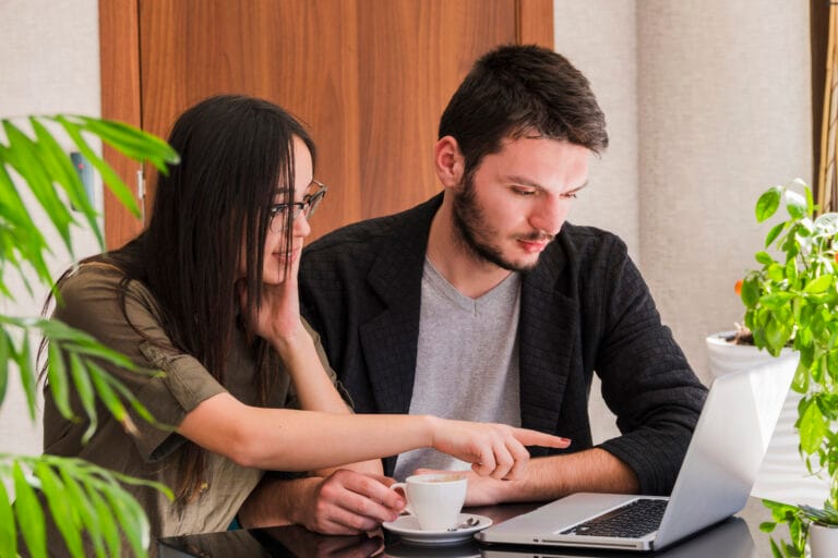 Coworkers looking at their website, thinking about their SEO